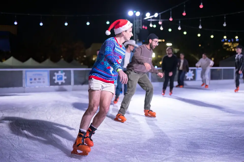 Skaters in holiday sweaters