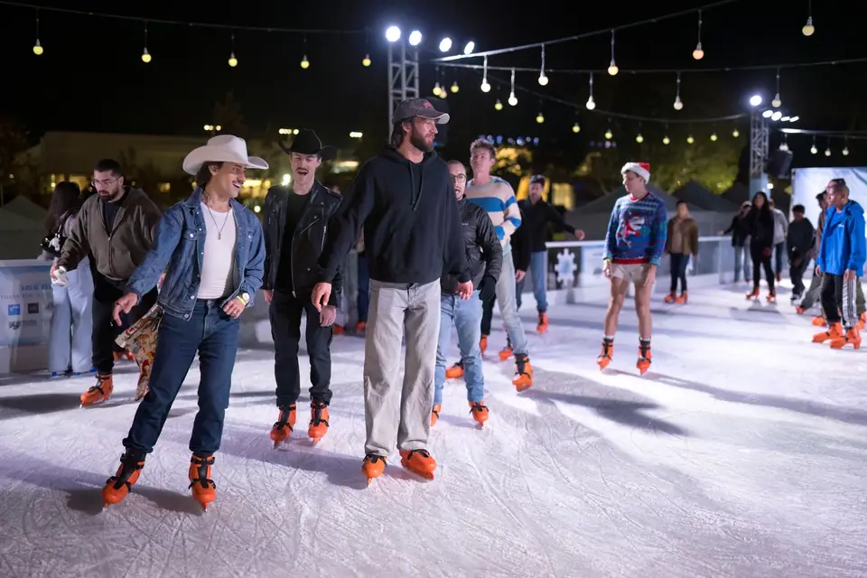 A group of friends skating at night
